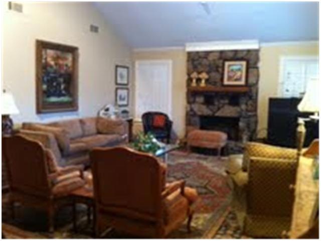 Beautiful cherry greatroom with fireplace and vaul