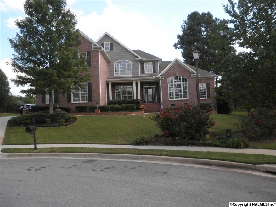 The covered front porch will lead you into this inviting home at the end of a quiet cul-de-sac.