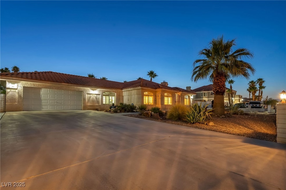Mediterranean / spanish-style home with a garage,