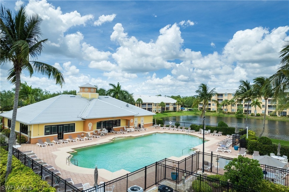 View of pool featuring a patio and a water view