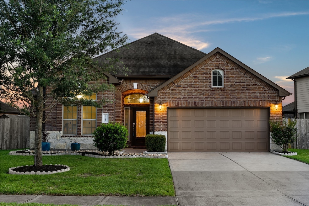 Welcome home to 28911 Dryander Forest Court located on a quiet street in Tamarron and zoned to Lamar Consolidated ISD! This stunning home has lovely curb appeal, a well-manicured lawn, beautiful landscaping, stone/brick elevation, dark stained front door with glass detailing, traditional style, beautiful outdoor lanterns, and a double wide driveway!