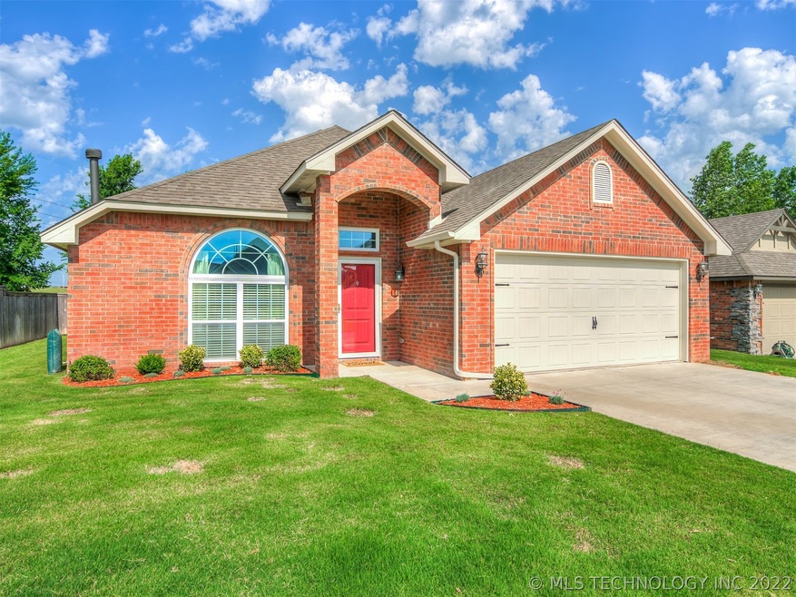 Full brick home with brick tower entry