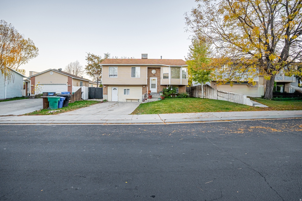 Bi-level home featuring brick siding and a chimney