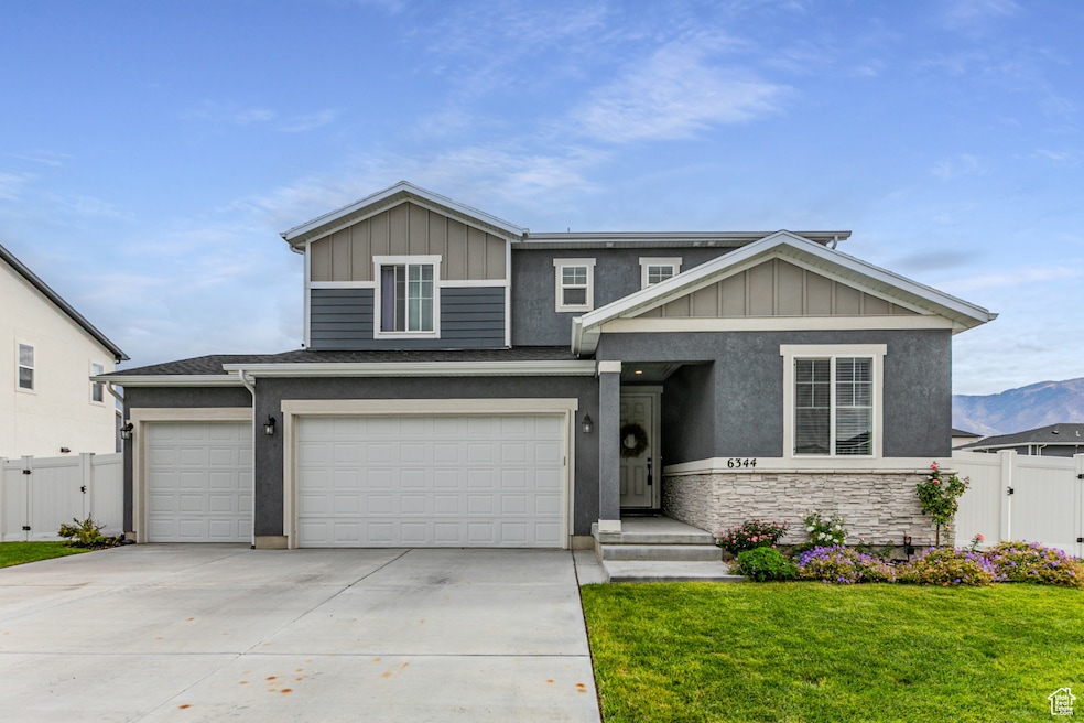 Beautiful home with 3 car garage and access gates to back yard on both sides.