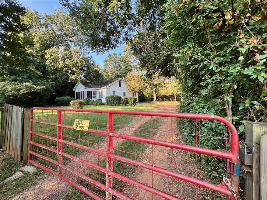 Gate featuring view of scattered trees