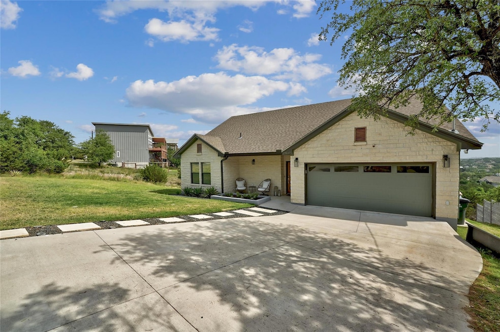 Traditional home featuring concrete driveway, a f