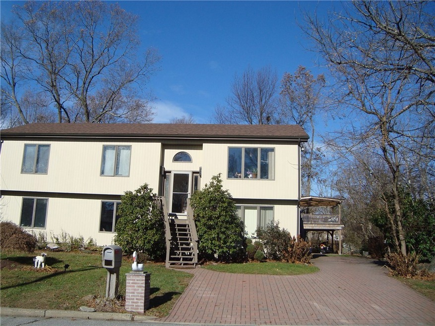 Well kept home with lovely paver driveway