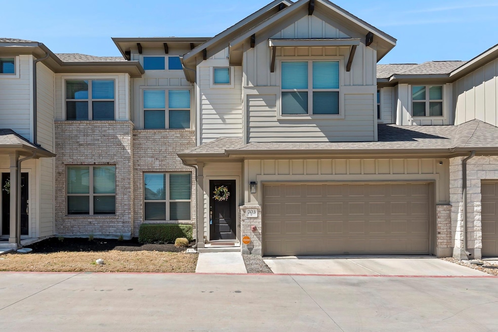 Townhome / multi-family property featuring concre