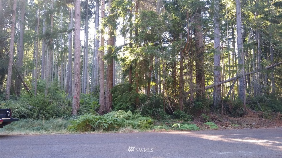 Wide, level building lot on private cul de sac, close to salt water marina and Lake Josephine amenities!