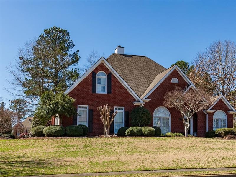 Four sided brick home on corner lot.
