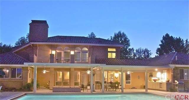 View of the back of the home from the rear lawn ov