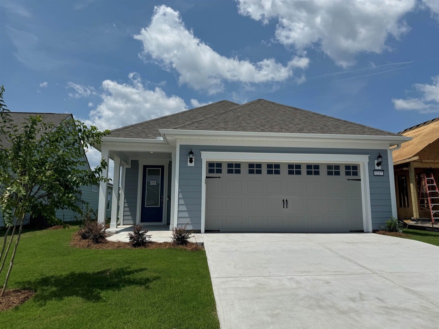 View of front of house featuring a garage and a fr