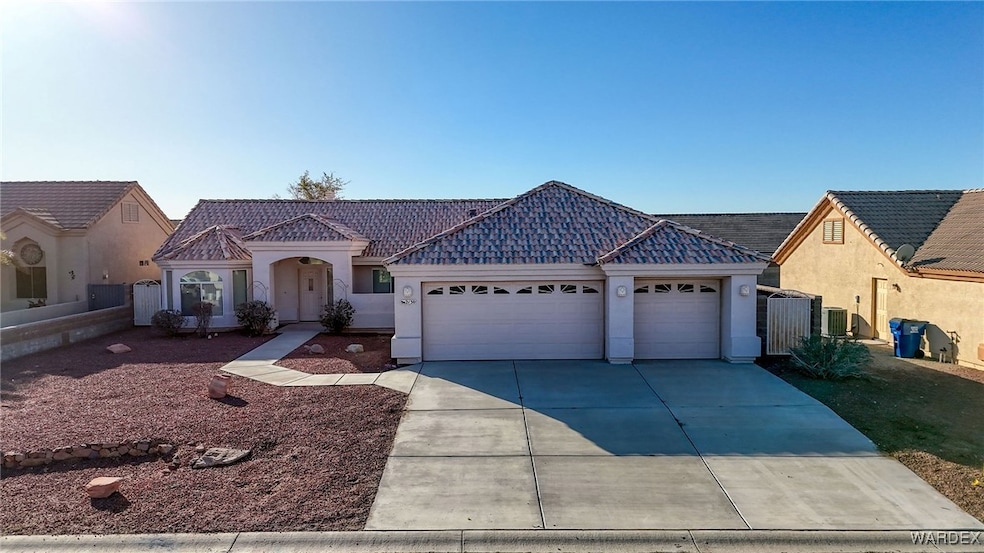 Single story home featuring central AC and a garag