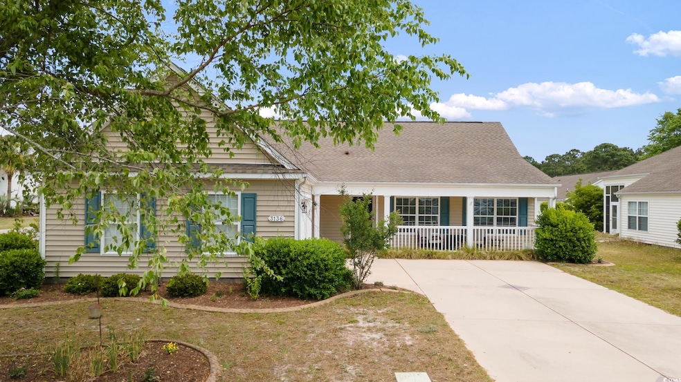 View of front of home featuring a porch, a front l