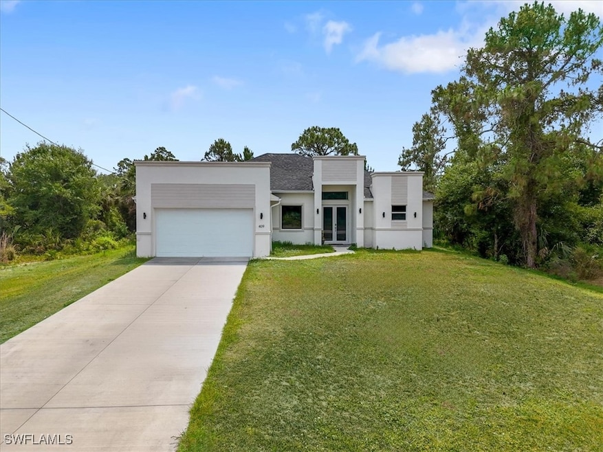 Modern home with french doors, stucco siding, an a