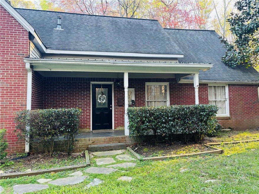 Covered porch and a front lawn