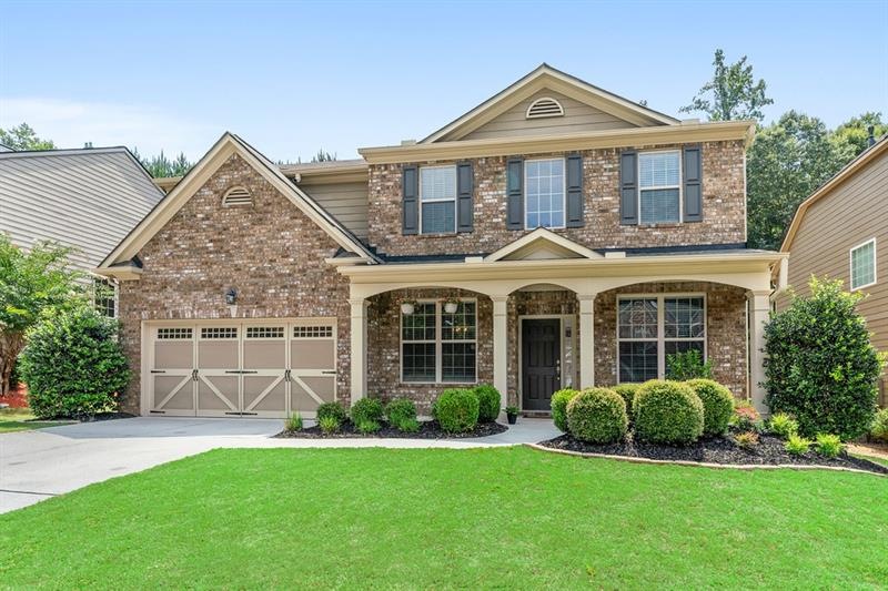Very pretty curb appeal and level lot.
