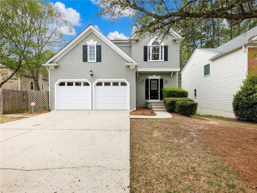 View of property featuring a garage