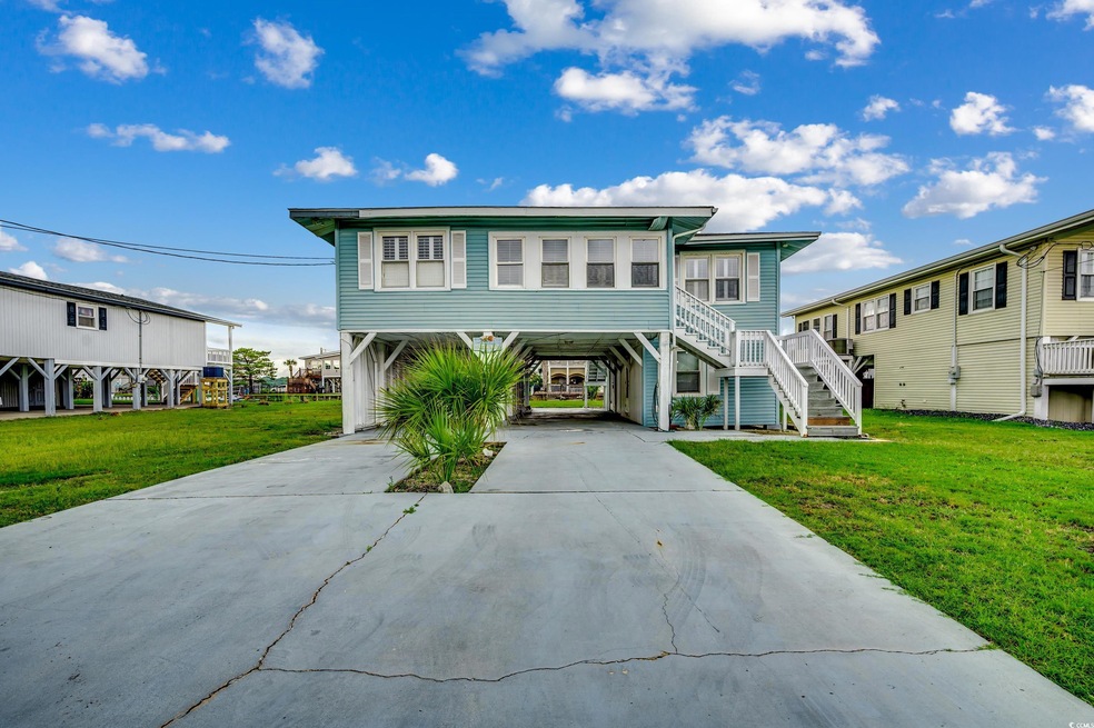 View of front of property featuring a carport and 