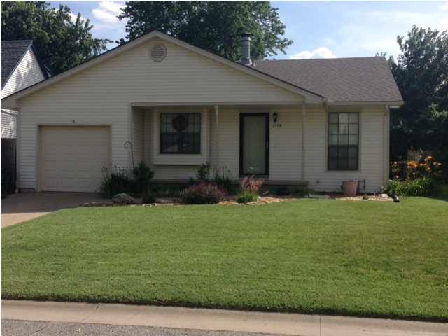 Front of home with nice landscaping