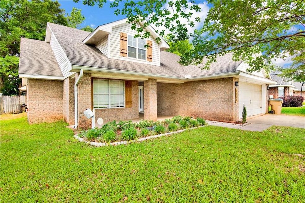 View of front of property with a shingled roof, an