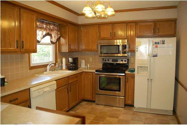 Kitchen with newer appliances and window looking i