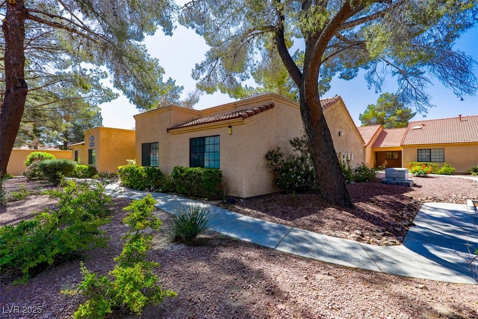 Mediterranean / spanish-style house with a tiled r