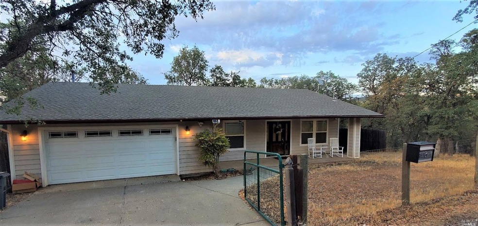 Front of home with gated driveway