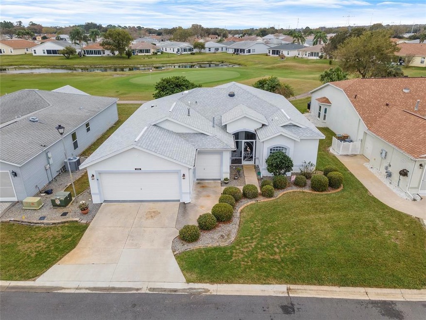 THIS STUNNING 3 BEDRM/2 BTH HOME WITH A GOLF CART GARAGE WITH A GOLF COURSE AND WATER VIEW IN PENNBROOKE FAIRWAYS!