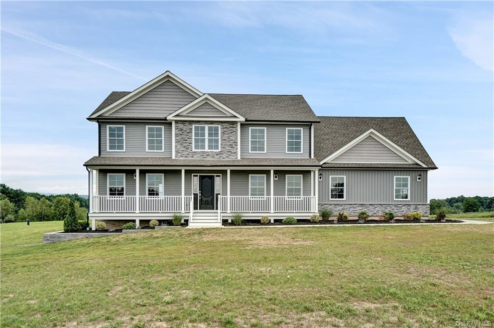 Natural stone accents this beautiful home on a fla
