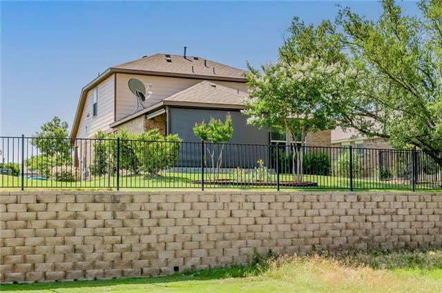 View from street behind the home, which sits up high for privacy. Power shade too!