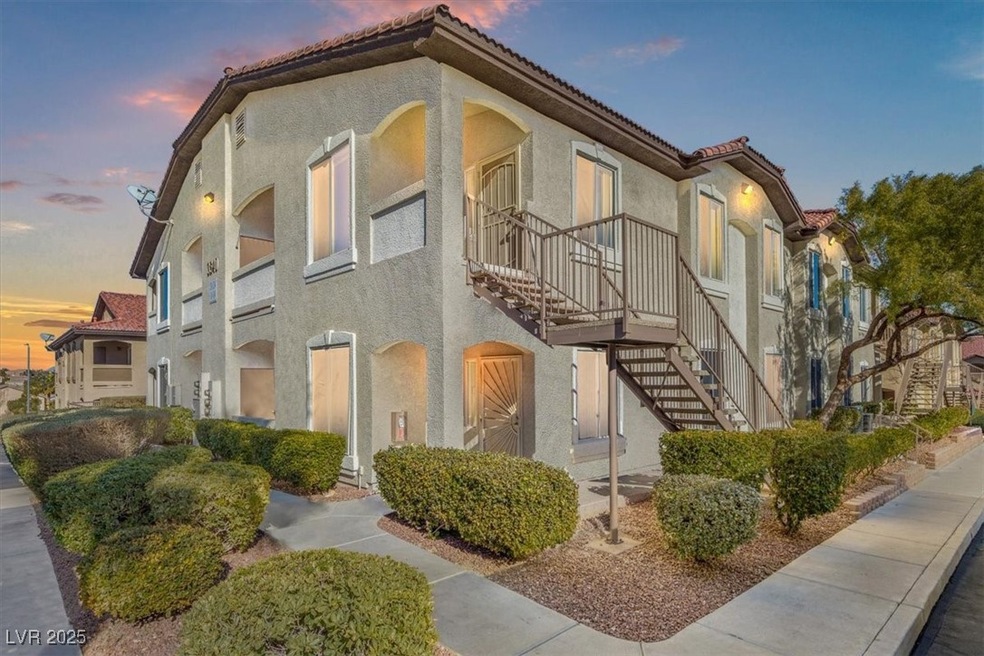 View of property with stairs