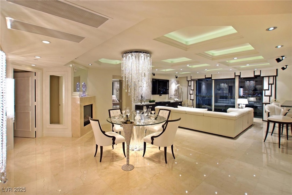 Dining room featuring marble finish floor, coffere