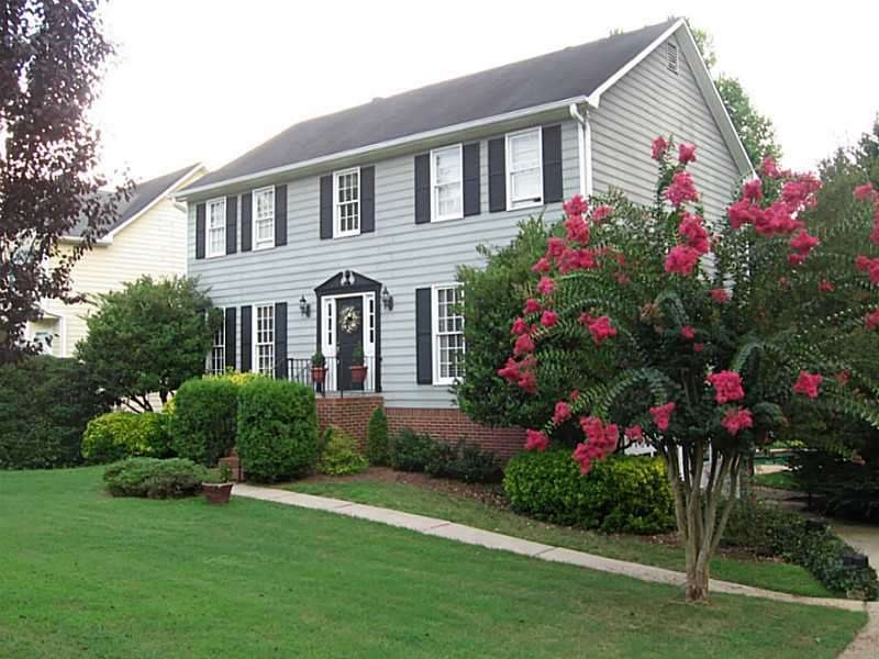Exterior Front. Beautifully Landscaped  Traditiona