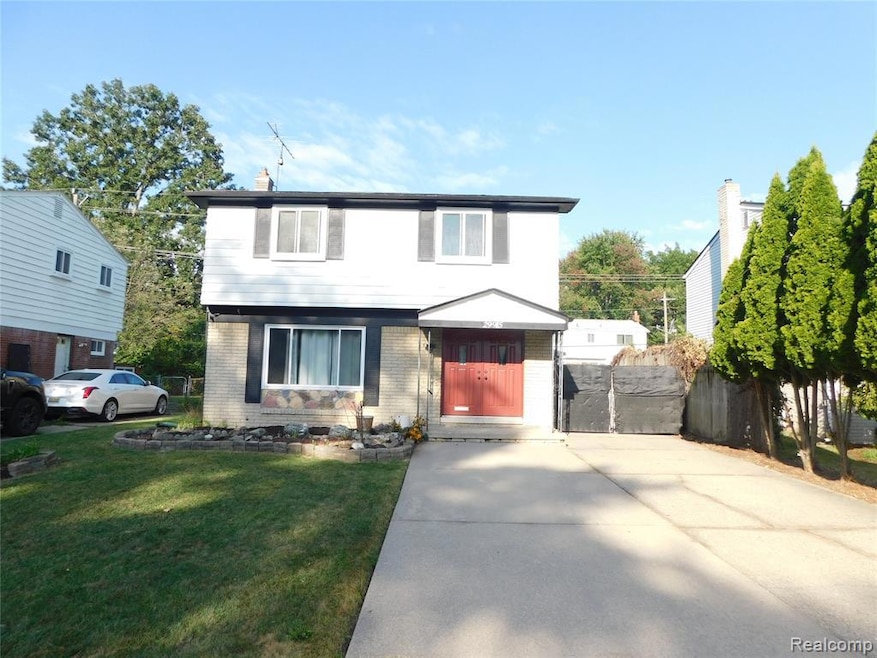 Colonial inspired home with brick siding and a chimney