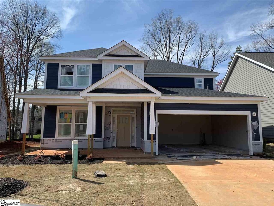 Front layout offers brick accents, covered front p
