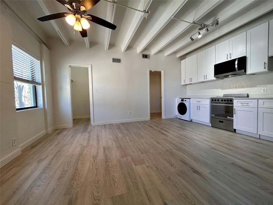 Kitchen featuring washer / dryer, appliances with