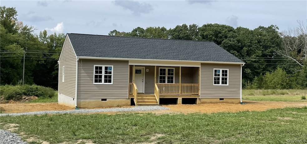 View of front facade with a front lawn and covered