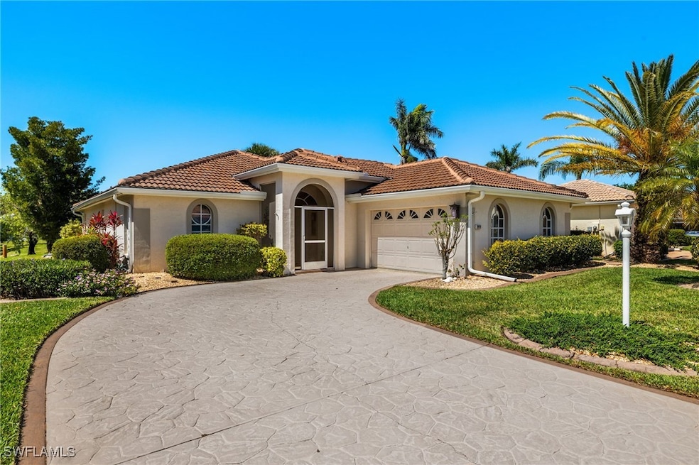 Mediterranean / spanish house featuring a tile roo