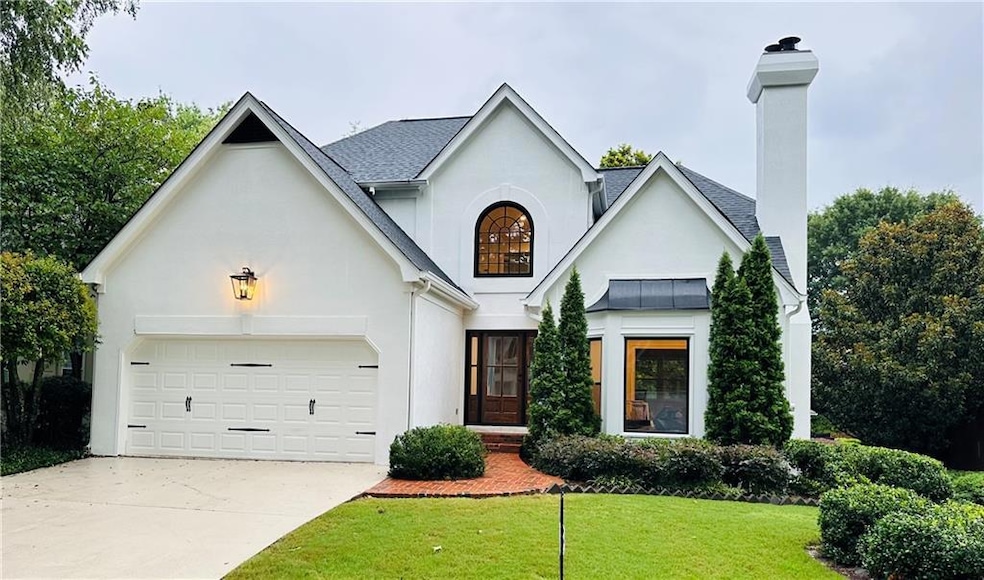 View of front of house with a two car garage and f