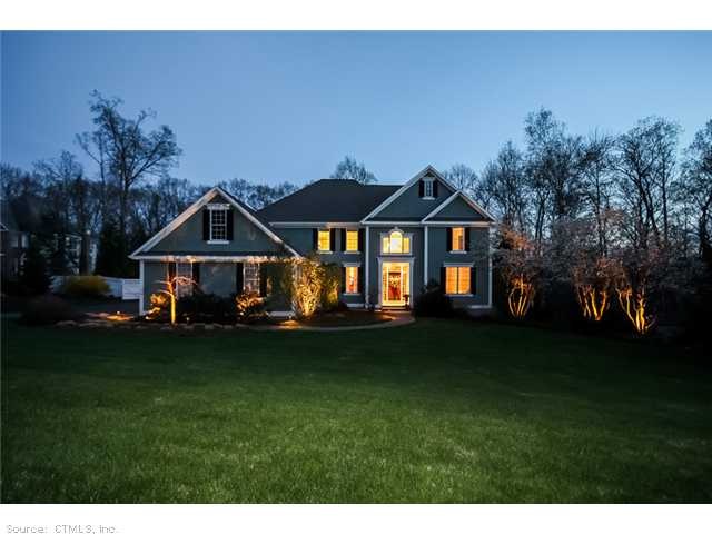 Exterior Front. Professionally landscaped and lit!