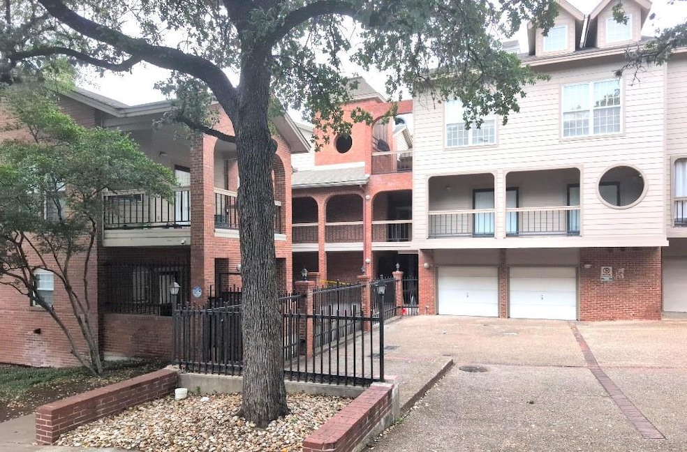 View of building exterior featuring driveway, an 