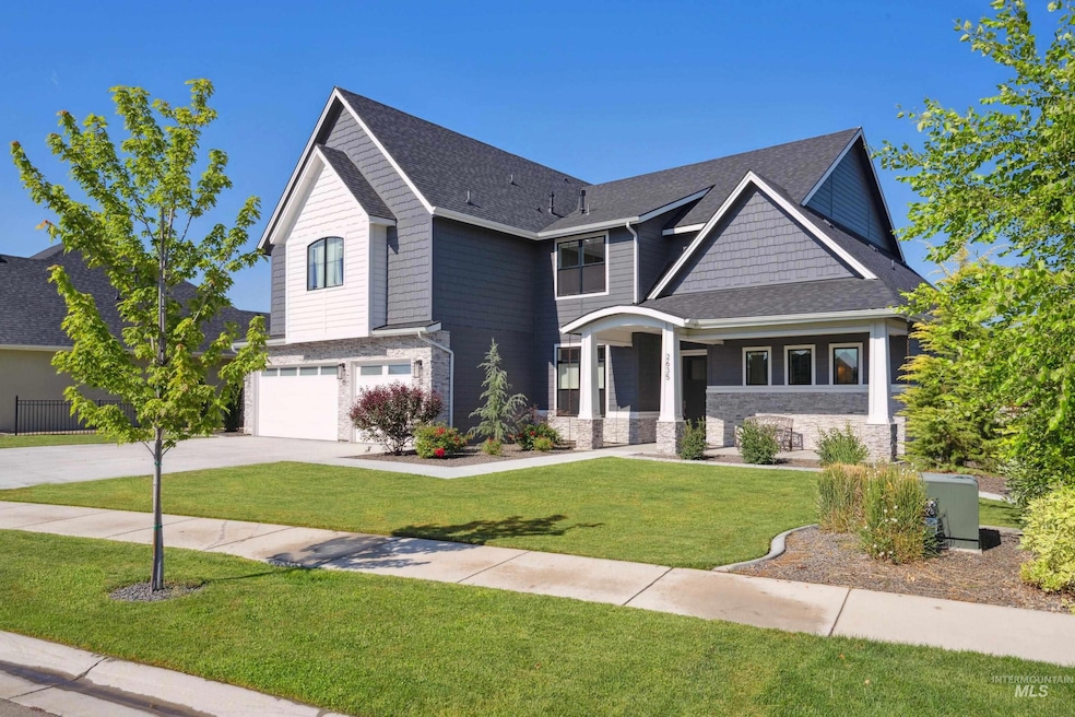 Craftsman house featuring a garage, stone siding, concrete driveway, a front yard, and a shingled roof