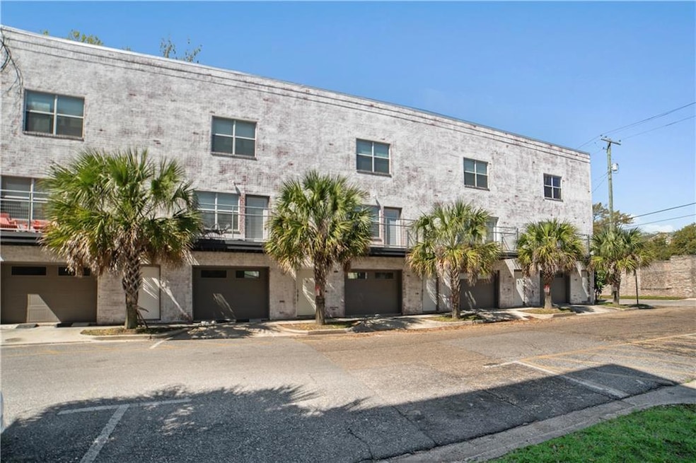 View of property featuring a garage