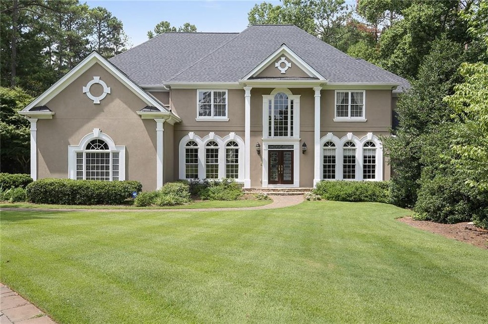 Front of home, featuring pavestone driveway and 3 