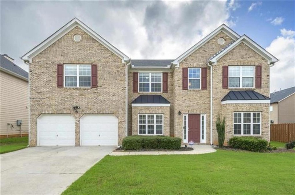 View of front of property with a front yard and a 