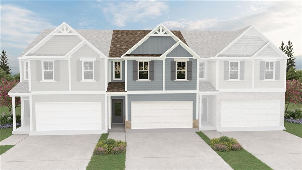 View of front of property featuring an attached ga