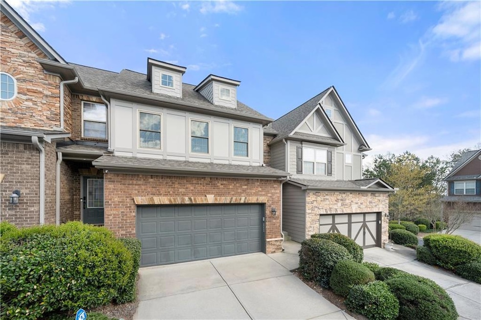 Townhome / multi-family property featuring brick s