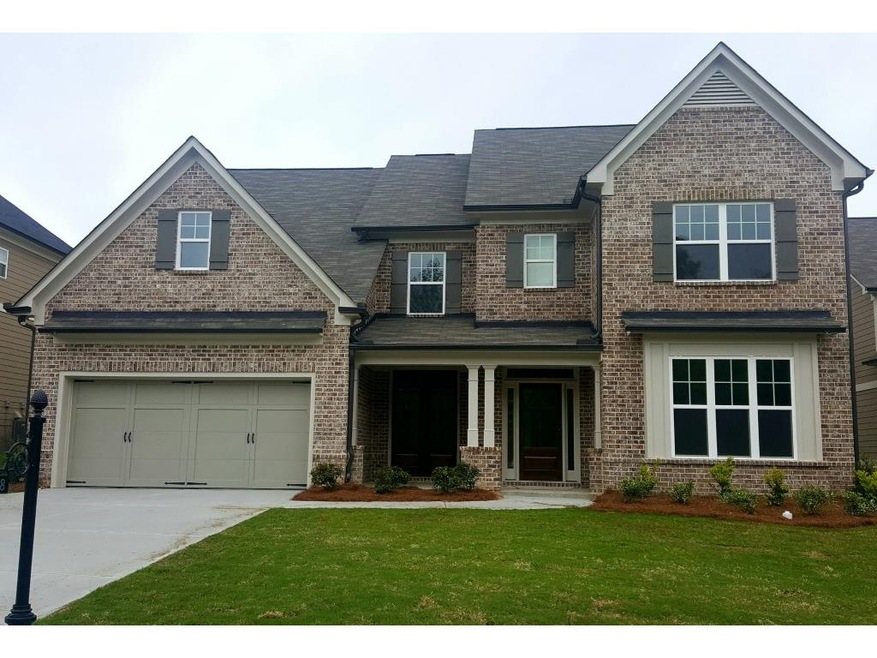 Homesite 20B has a brick front exterior with a cov