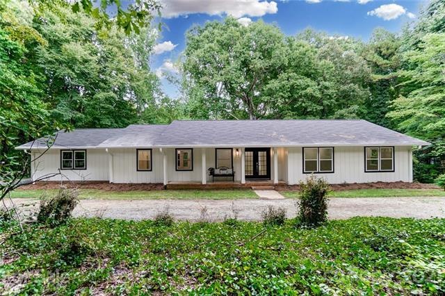 Gorgeous farmhouse style home on nearly 3 wooded a